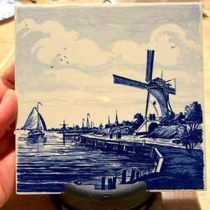 Delft windmill and boat coming into shore title